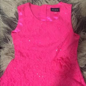Children place pink lace dress